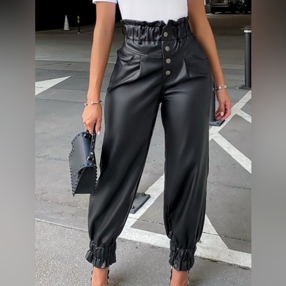 FASHIONABLE POLYURETHANE LEATHER LOOK PANT. RUFFLED TRIM.